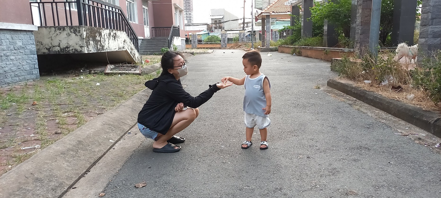 Nhi playing with son Lion outdoors - Mothers accept stepping back